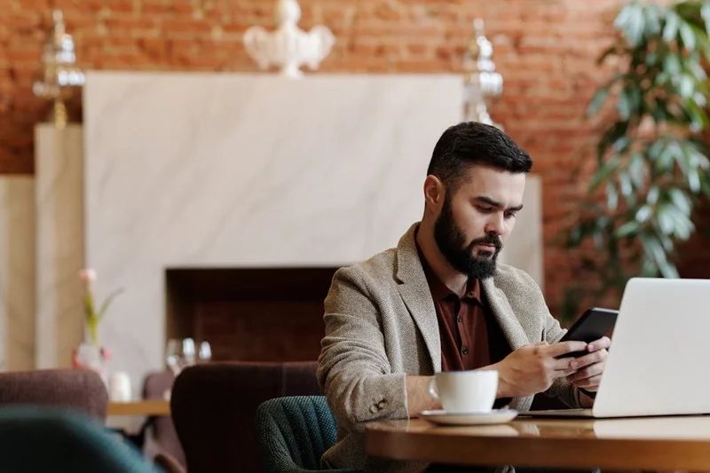 A blogger writing a detailed restaurant review on a laptop