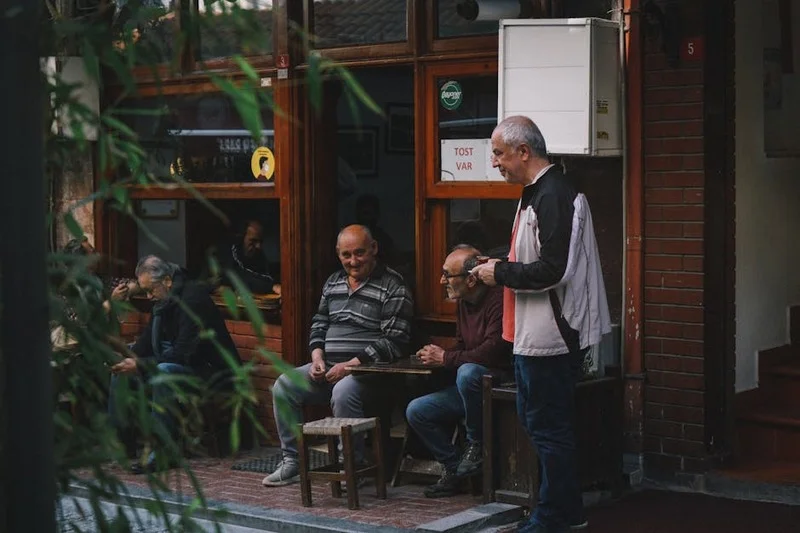 Locals discussing restaurant recommendations in a cozy cafe setting
