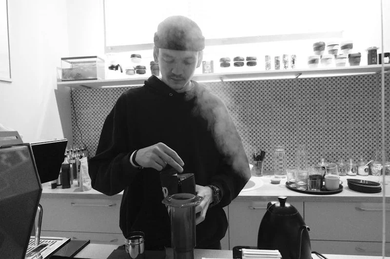 Person making Aeropress coffee at home