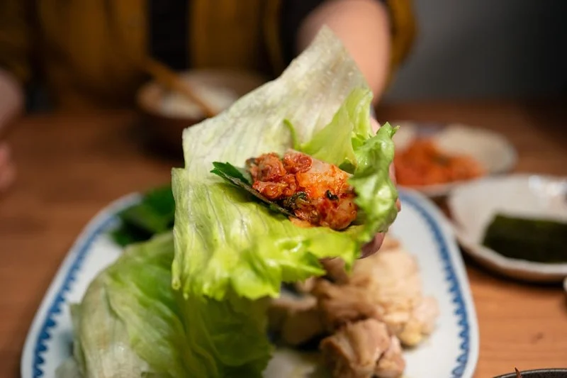 A vibrant selection of fermented vegan foods including kimchi, kombucha, and tempeh, showcasing culinary trends