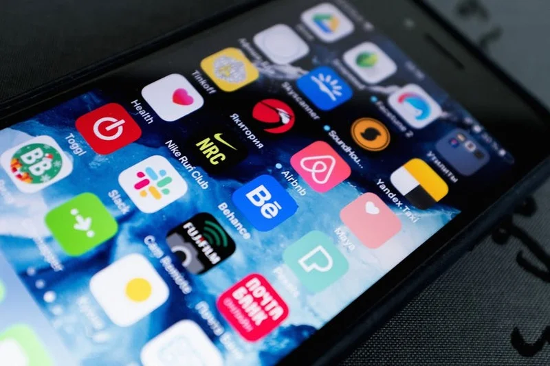 Mobile phone displaying different food review applications