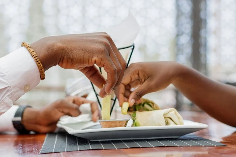 Diners leaving a tip on a restaurant table after a meal